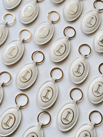 Lighthouse Puff Leather Keychain – Off-White Oval Gold Stamped